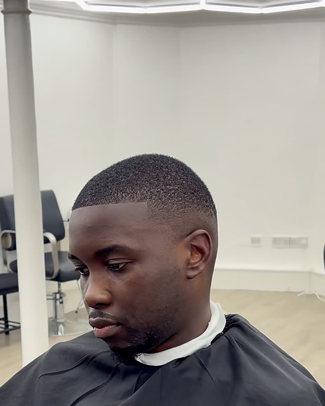 Fresh buzz cut under the hex lights